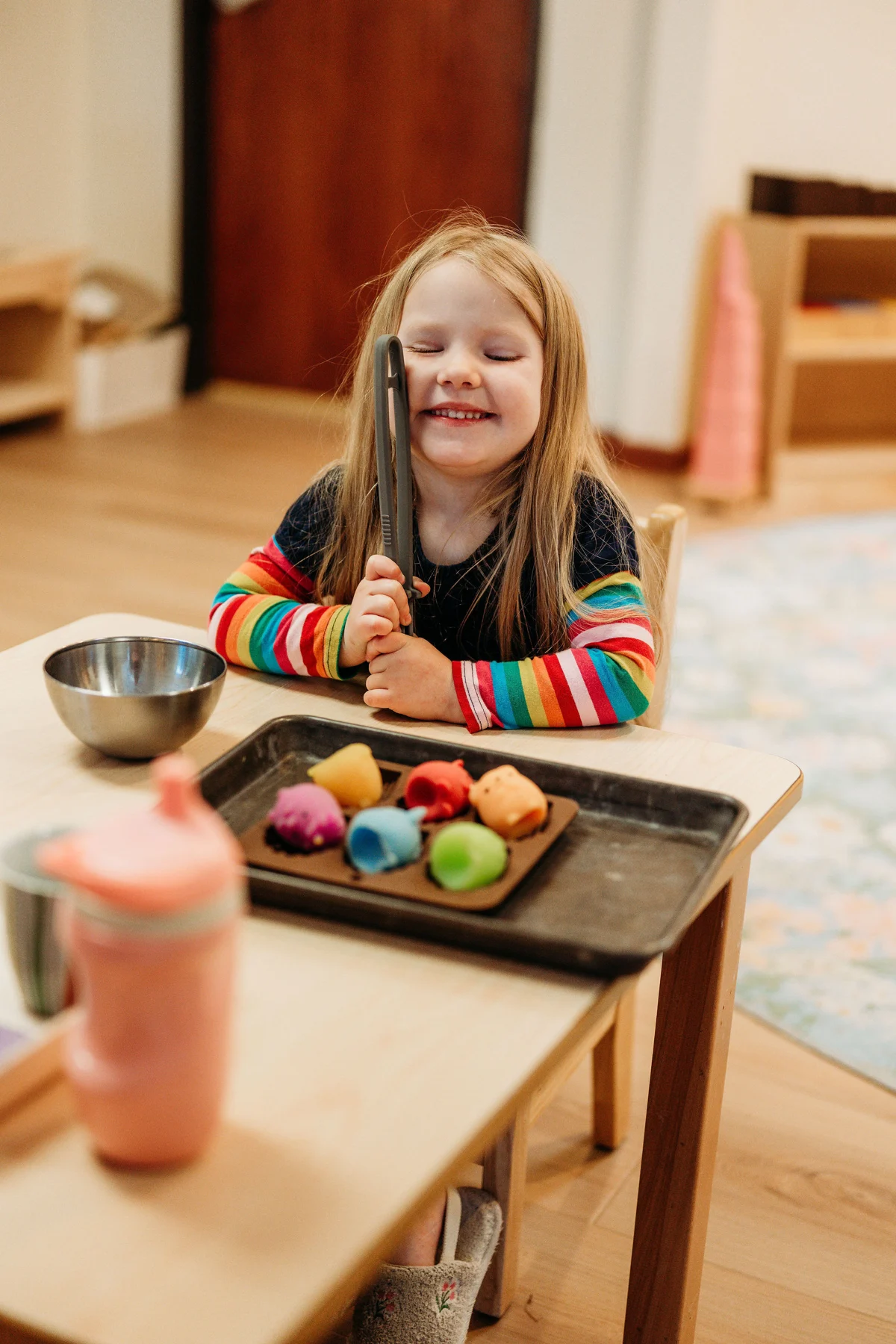 A child exploring classroom materials at Kindred Hill Montessori