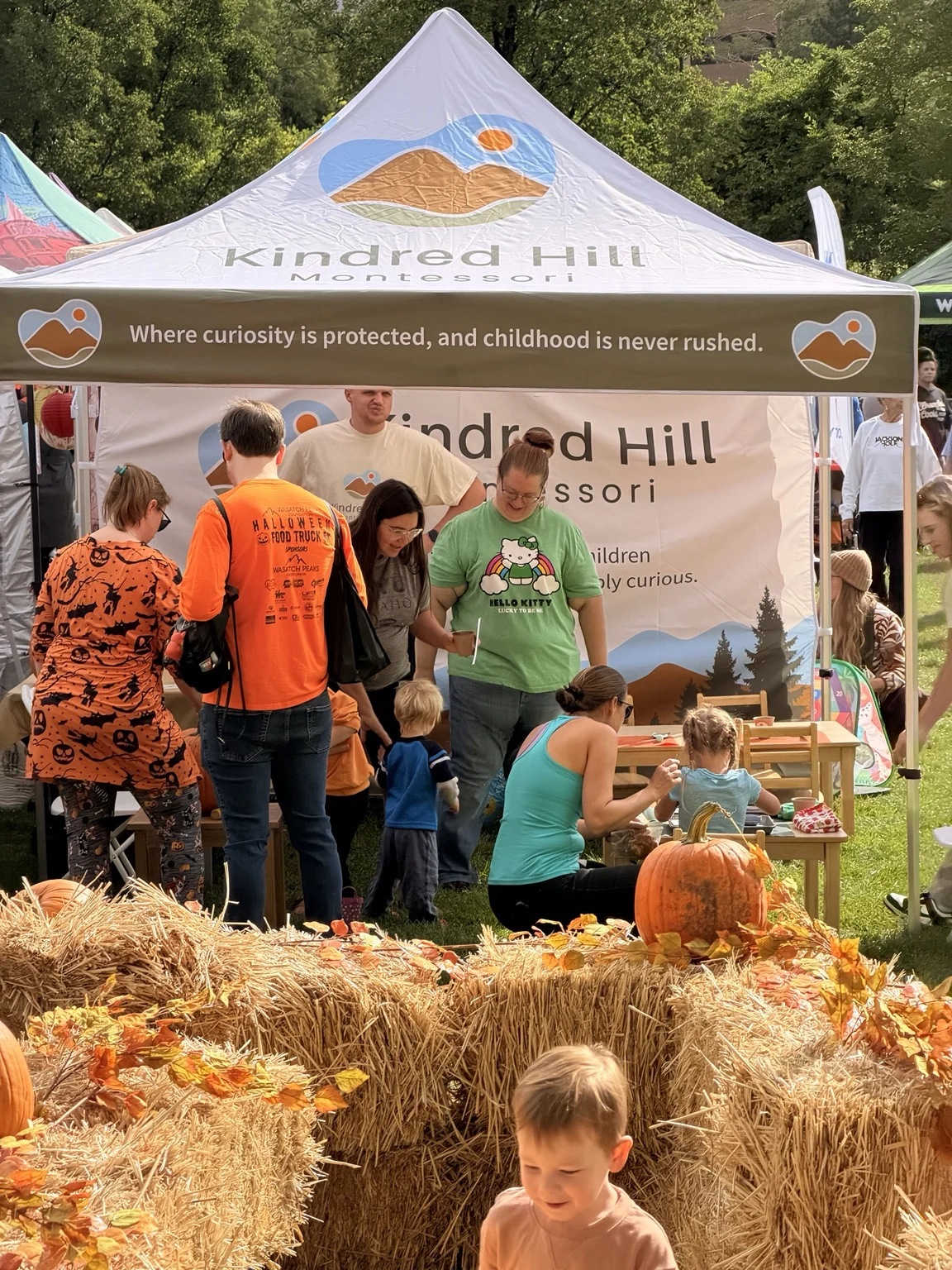 Families gathered at the Kindred Hill booth during Ogden’s Harvest Moon Festival